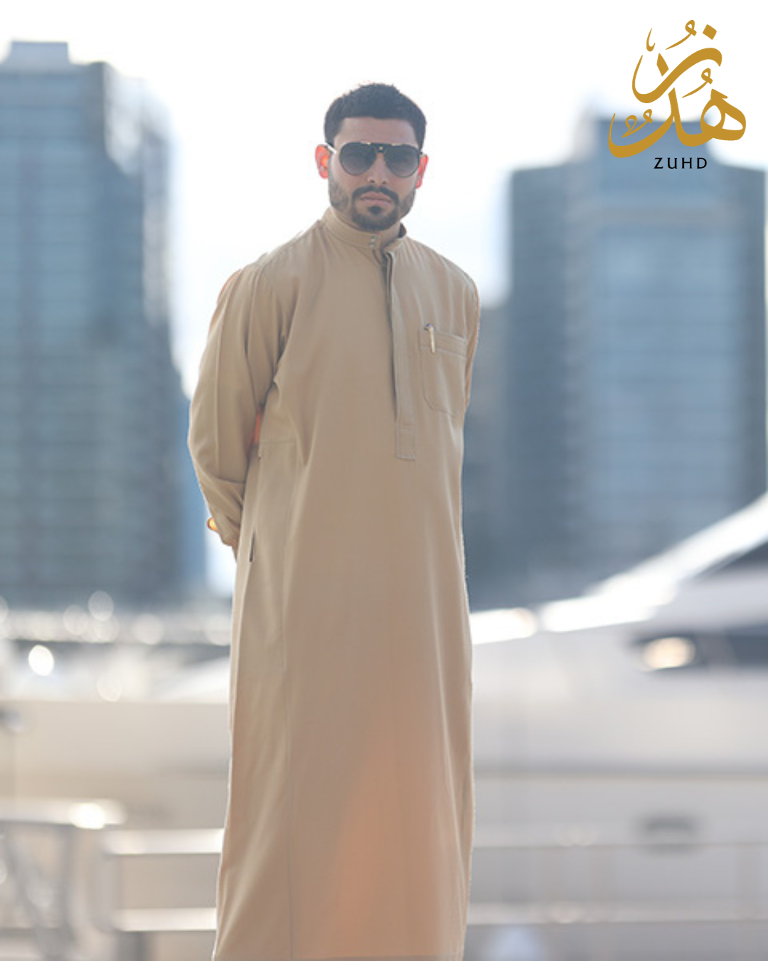  A person standing in fancy jubbah. you can Buy Custom-Made Jubbah Online from Zuhd Store